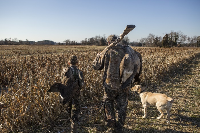 Father and son waterfowl hunting