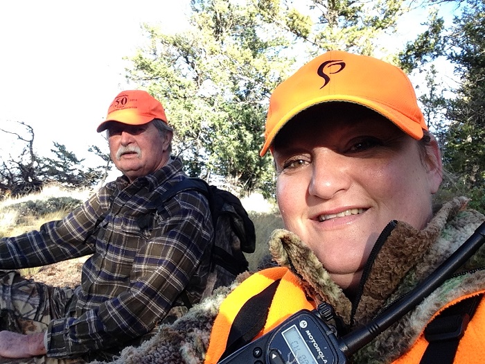 Man and woman pose for a selfie while hunting